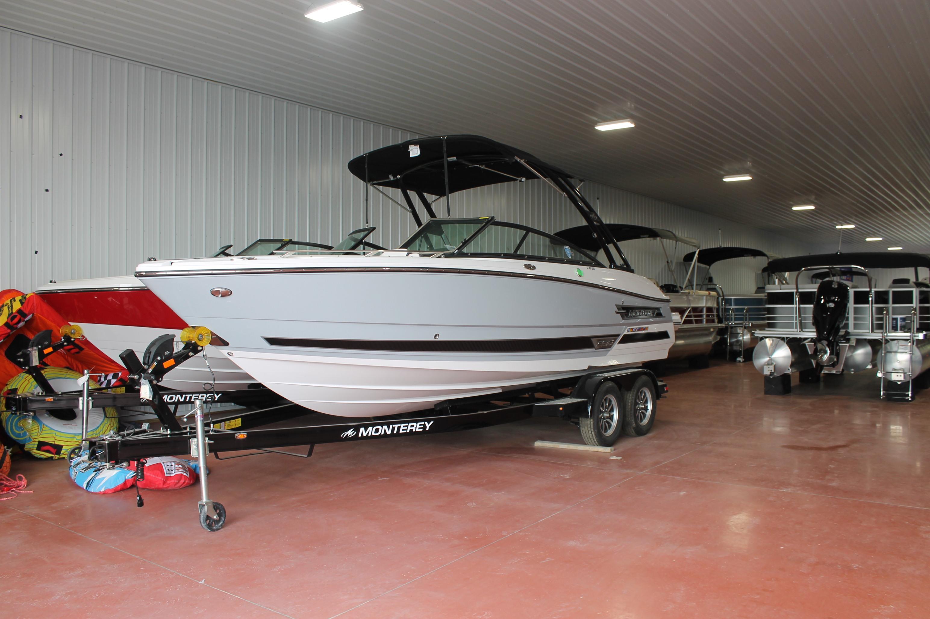 Monterey 238 Super Sport 2024 Monterey 238 Super Sport boat in indoor showroom, on trailer.