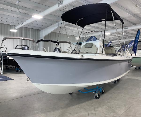 Key West 1720 Sportsman 2024 Key West 1720 Sportsman boat displayed in a showroom.