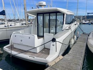 Jeanneau NC 11 2015 Jeanneau NC 11 yacht docked at marina, showcasing sleek design and modern features.