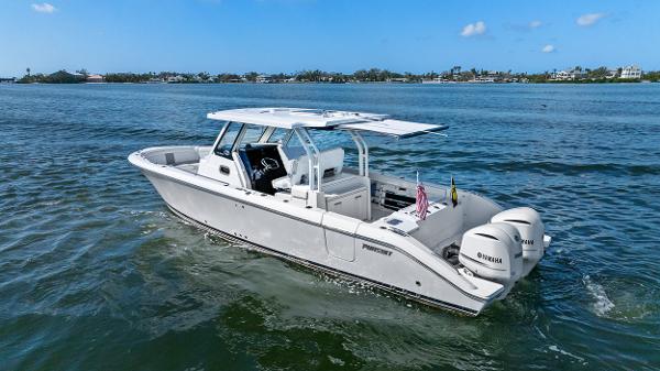 Pursuit S 328 Sport 2021 Pursuit S 328 Sport boat on open water, featuring twin Yamaha engines.