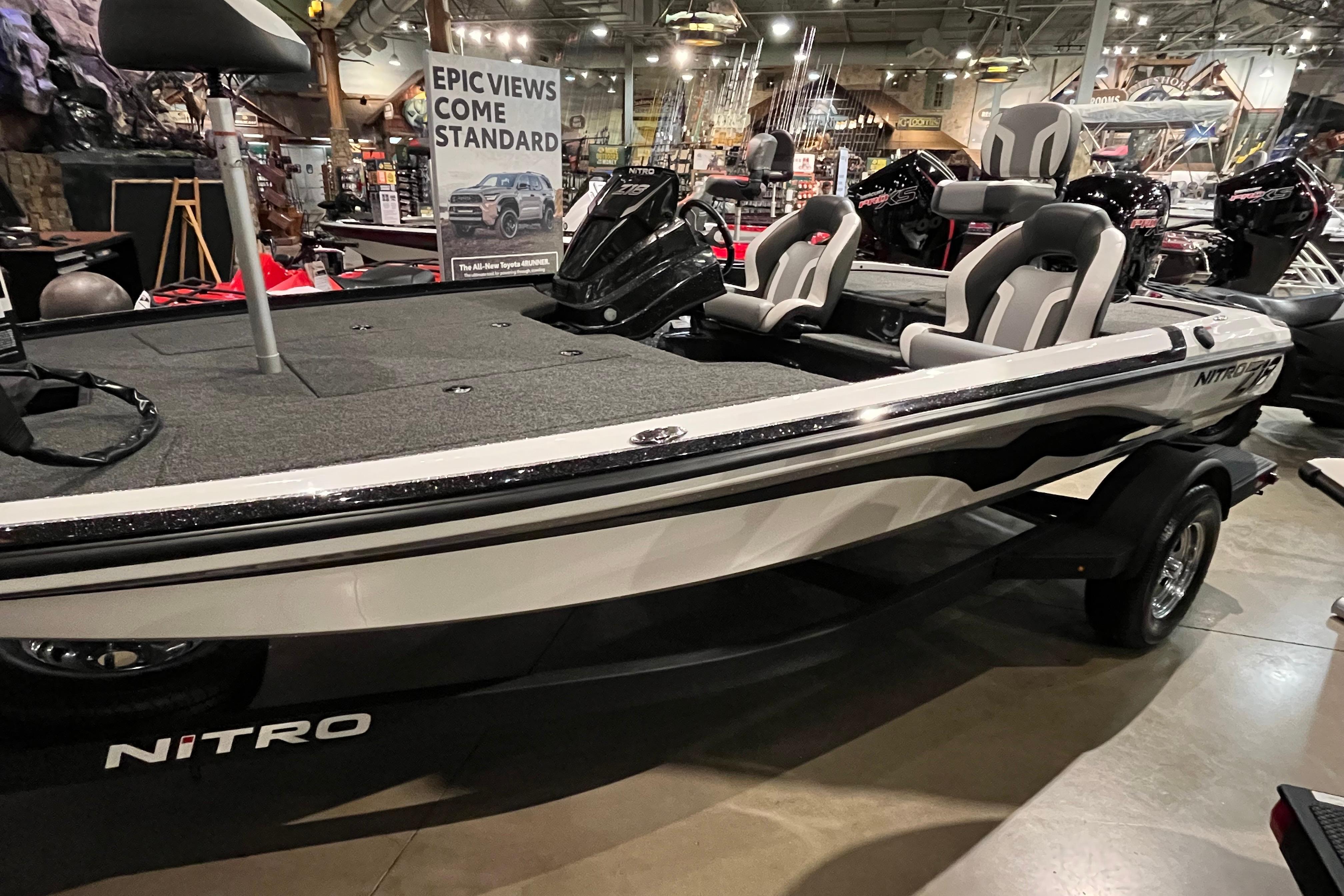 Nitro Z18 2025 Nitro Z18 boat on display in showroom, featuring sleek design and comfortable seating.