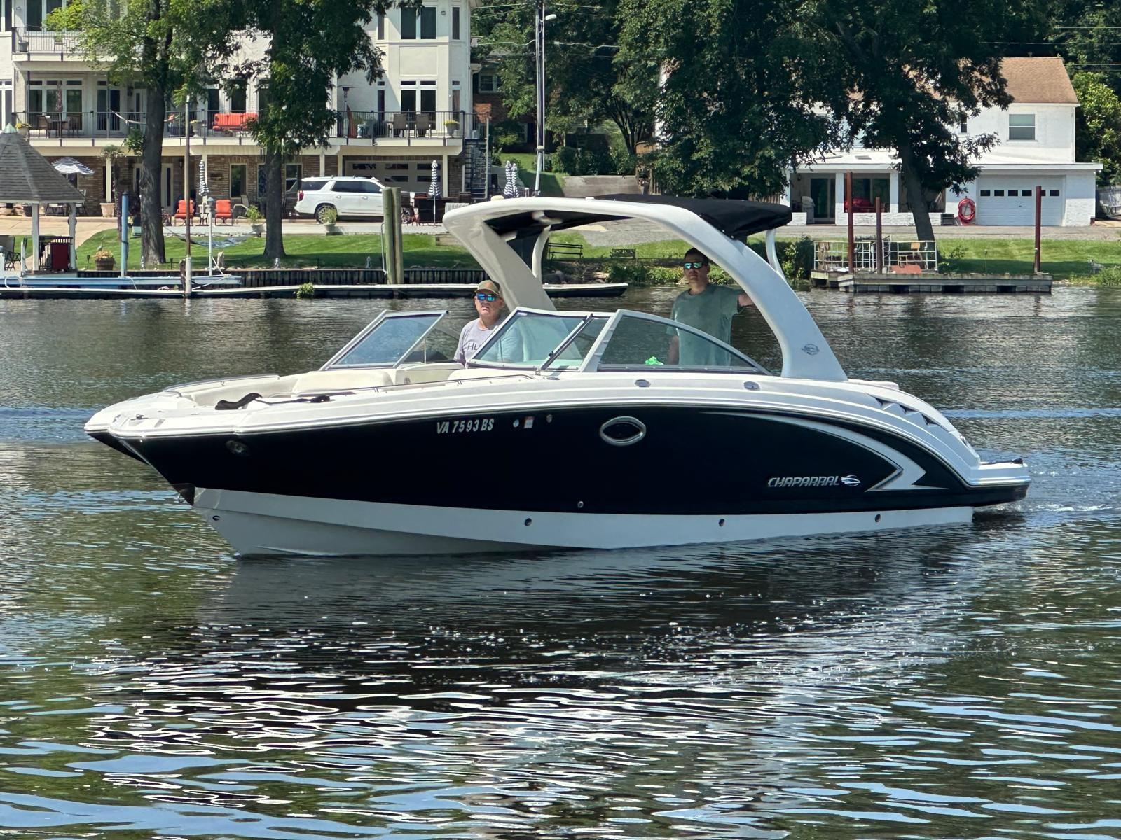 Chaparral Sunesta 284 2008 Chaparral Sunesta 284 boat on a calm lake near waterfront homes.
