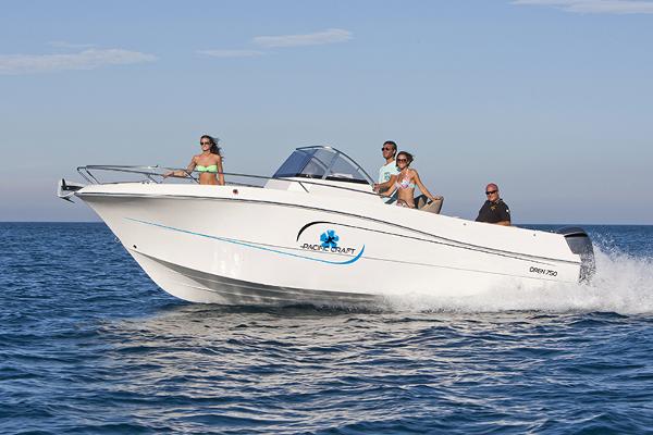 Pacific Craft 750 Open 2025 Pacific Craft 750 Open boat cruising with passengers on a sunny day.