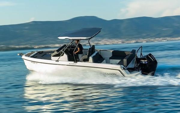 Protagon 25 Sundeck 2025 Protagon 25 Sundeck boat cruising on open water with scenic mountain backdrop.