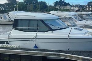 Jeanneau Merry Fisher 695 2016 Jeanneau Merry Fisher 695 boat docked in a marina, side view.