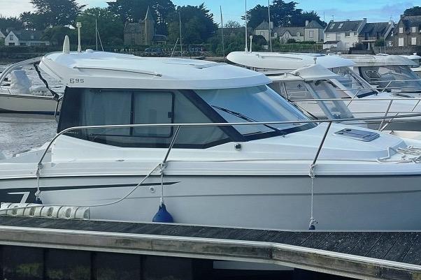 Jeanneau Merry Fisher 695 2016 Jeanneau Merry Fisher 695 boat docked in a marina, side view.