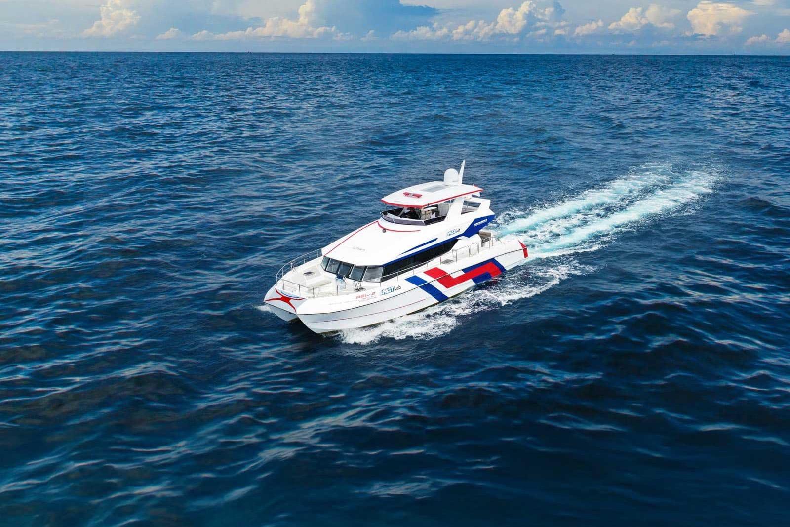 Custom custom Custom 2022 yacht cruising on open ocean under a partly cloudy sky.