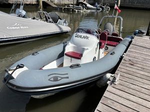 Ribeye A600 Ribeye A600 boat docked, featuring red seats and "Sealark" branding, 2007 model.
