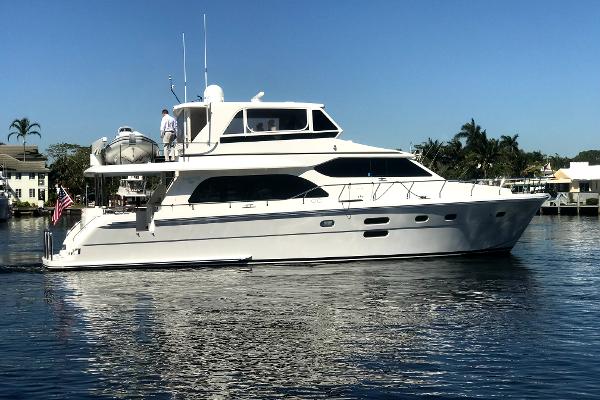 Hampton Motoryacht 2012 Hampton Motoryacht cruising on calm water under clear blue sky.