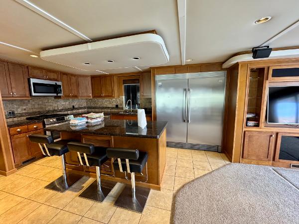 Bravada Helios Share #8 Luxurious kitchen interior on Bravada Helios Trip #8 houseboat, featuring modern appliances and sleek design.