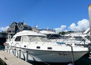 Fairline 36 Turbo 1986 Fairline 36 Turbo yacht docked at marina under clear blue sky.