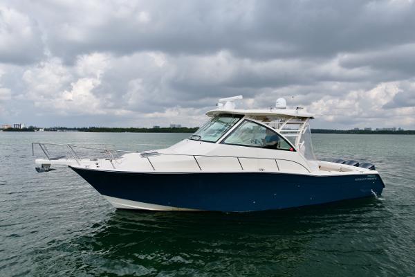 Grady-White Express 370 2016 Grady-White Express 370 boat on water under cloudy sky.