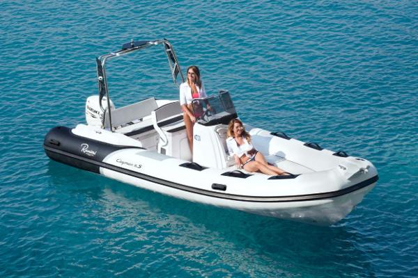 Ranieri CAYMAN 19 Sport 2025 Ranieri CAYMAN 19 Sport boat on clear blue water with two women onboard.