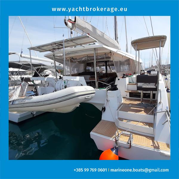 Nautitech 46 Open 2016 Nautitech 46 Open catamaran docked, featuring spacious deck and tender boat.