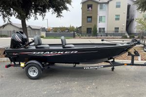 Tracker Super Guide V-16 T 2025 Tracker Super Guide V-16 T boat on trailer, parked outdoors.