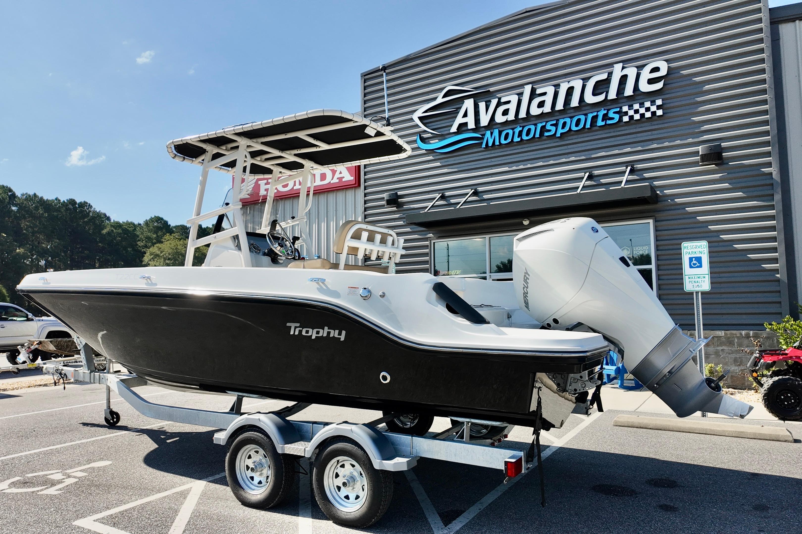 Bayliner Trophy T22CC 2026 Bayliner Trophy T22CC boat on trailer at Avalanche Motorsports dealership.