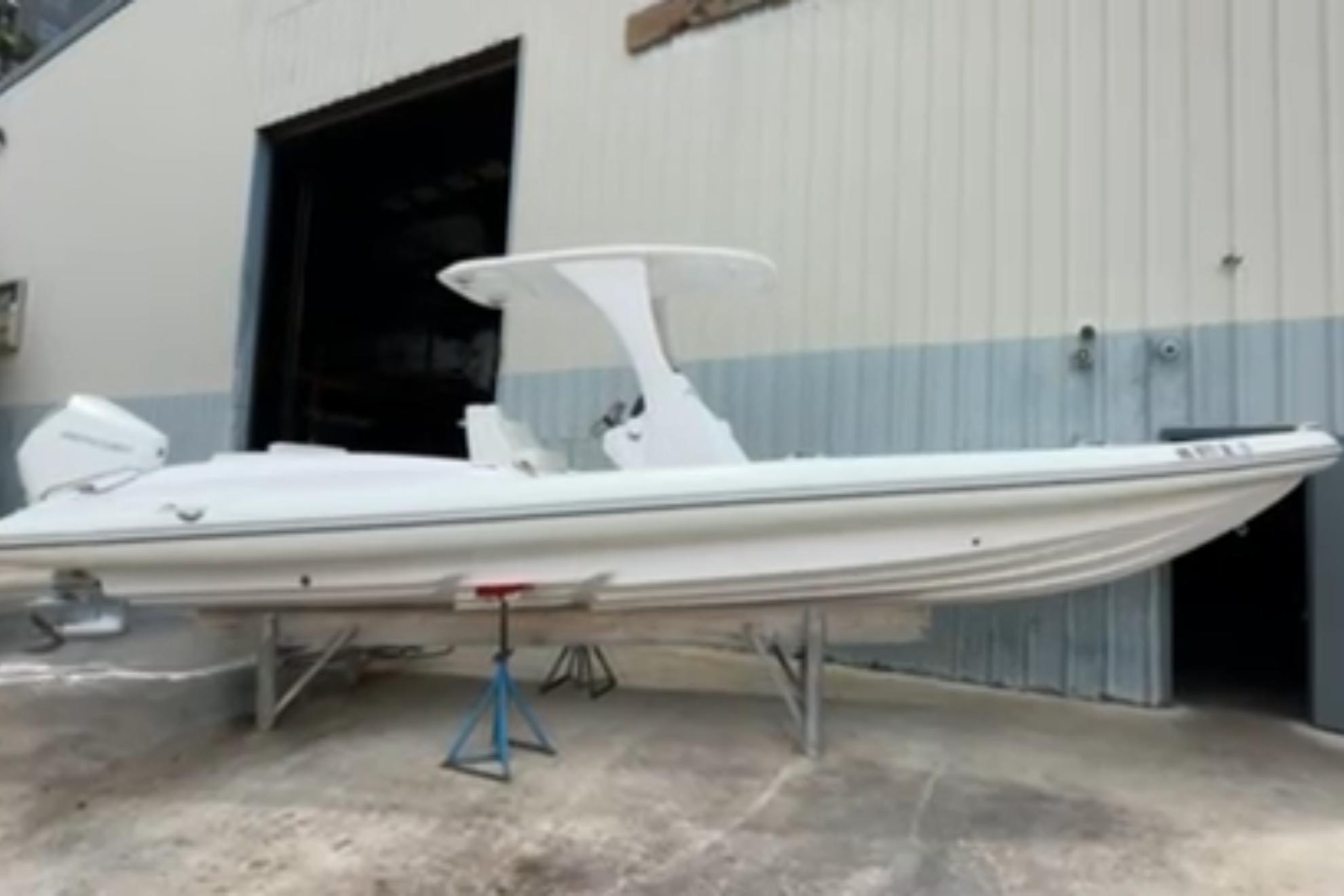 Airship 310-Rib 2023 Airship 310-Rib boat in a warehouse setting, elevated on stands.