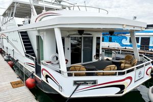 Sumerset Luxury HouseBoat 102' X 19' 2008 Sumerset Luxury HouseBoat 102' X 19' docked, featuring spacious deck and modern design.