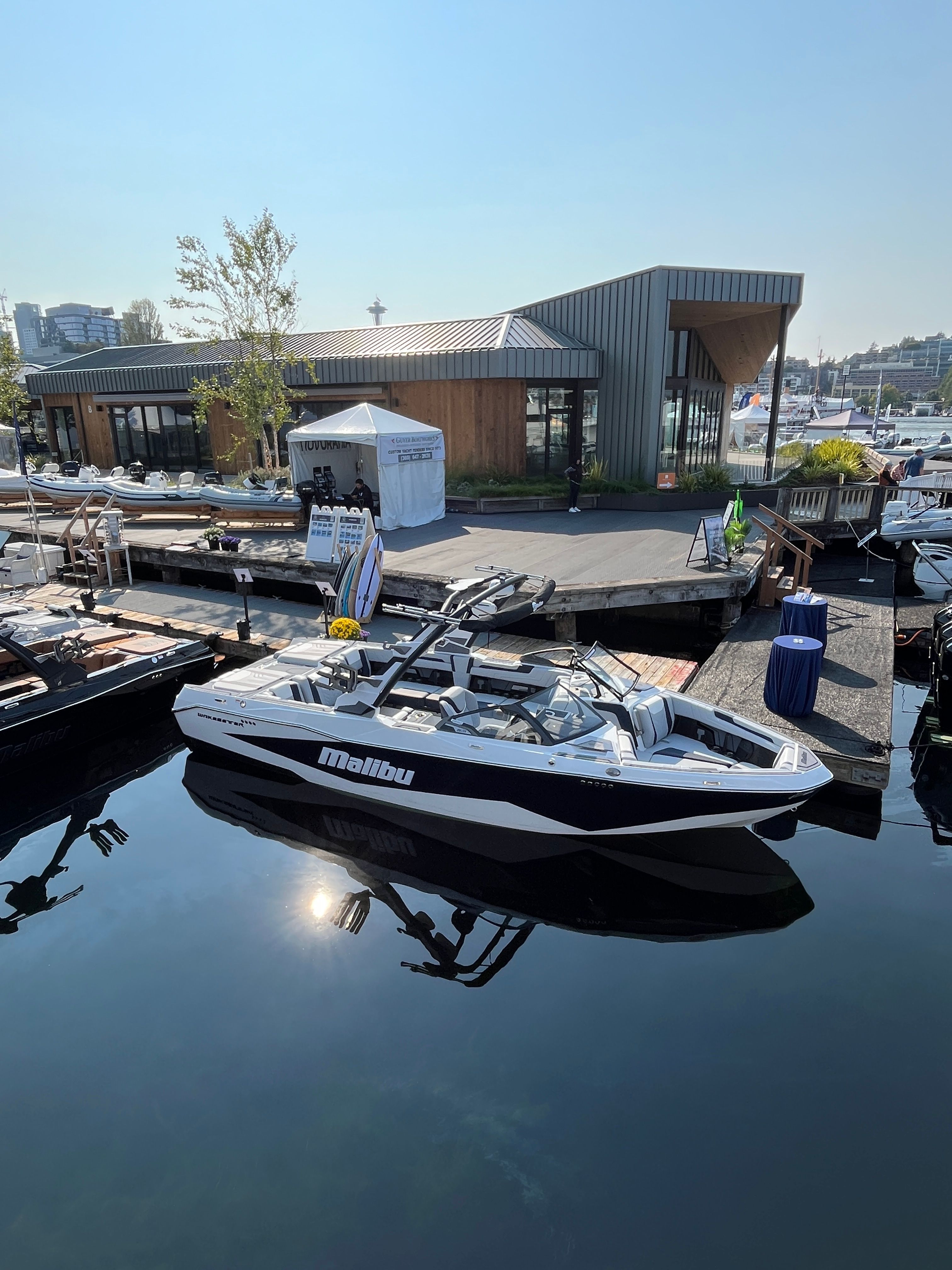 Malibu Wakesetter 25 LSV 2026 Malibu Wakesetter 25 LSV boat docked at a modern marina.