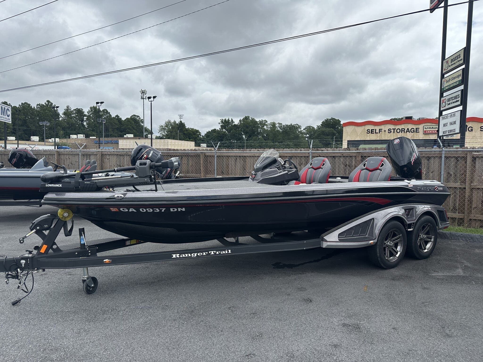 Ranger Z520R 2022 Ranger Z520R boat on trailer, parked outdoors near storage facility.