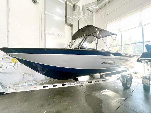 Starcraft Fishmaster 196 2023 Starcraft Fishmaster 196 boat on trailer in showroom.
