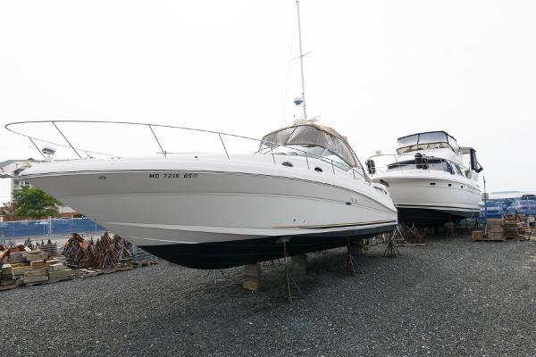 Sea Ray 340 Sundancer 2003 Sea Ray 340 Sundancer yacht on dry dock, alongside another boat.