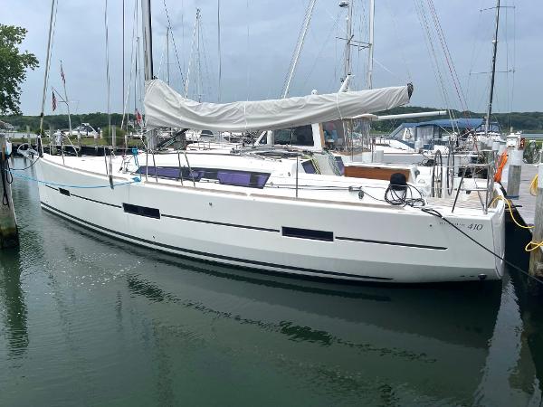 Dufour 410 GL 2015 Dufour 410 GL sailboat docked in marina, side view.