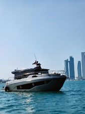 Cranchi T36 Crossover 2021 Cranchi T36 Crossover yacht cruising near modern city skyline.