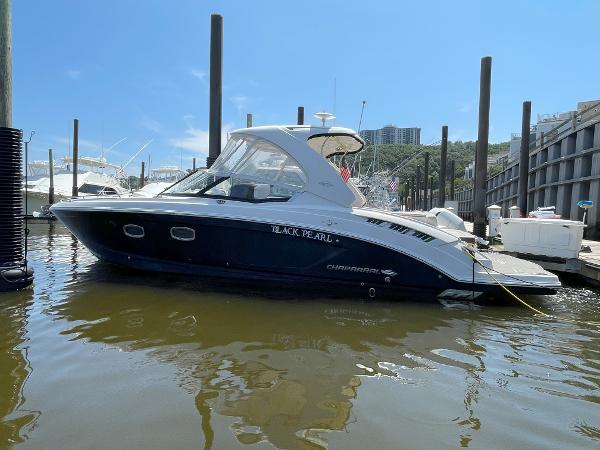 Chaparral 337 SSX 2018 Chaparral 337 SSX boat docked in a marina.