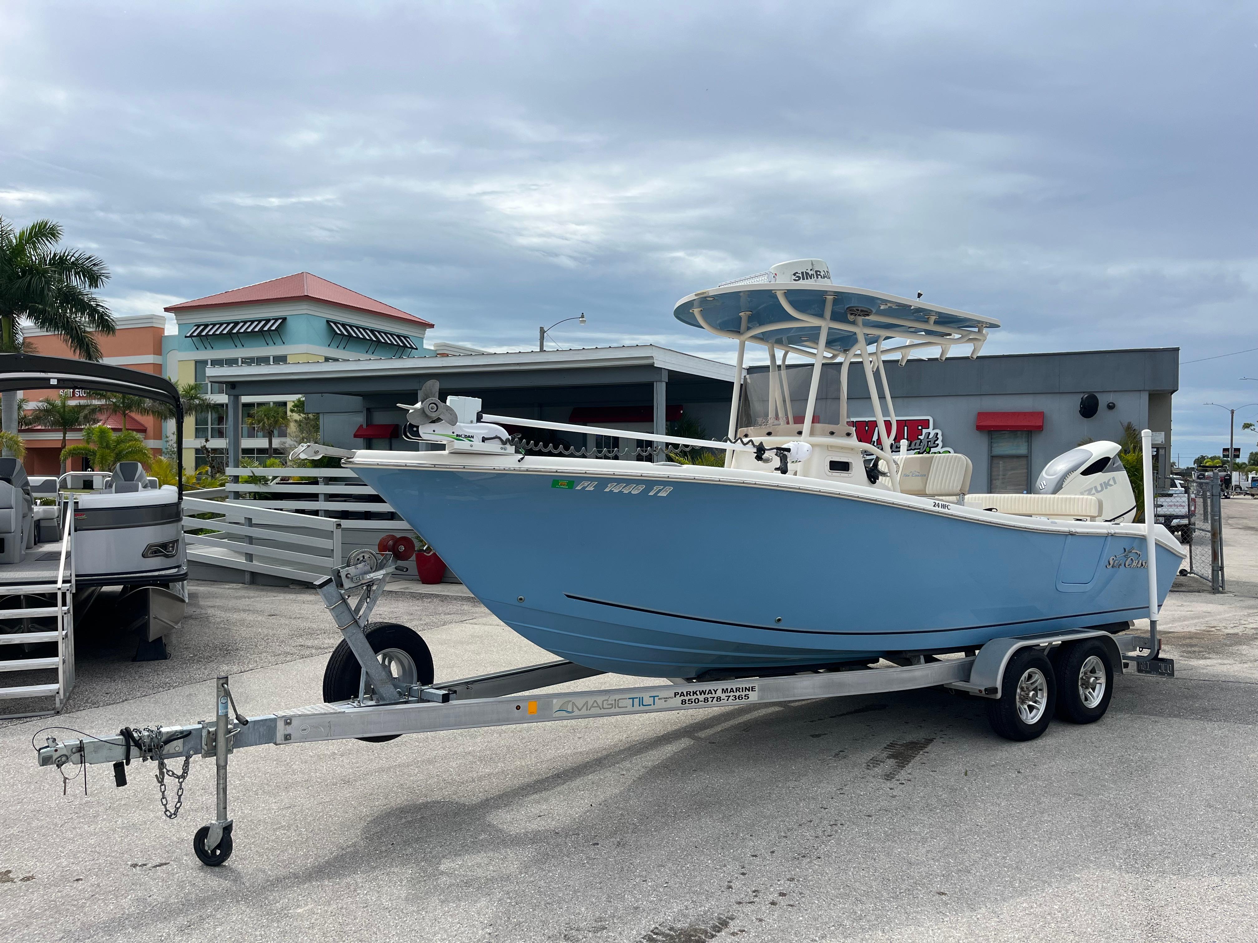 Sea Chaser 24 HFC 2019 Sea Chaser 24 HFC boat on trailer, parked outdoors near buildings.
