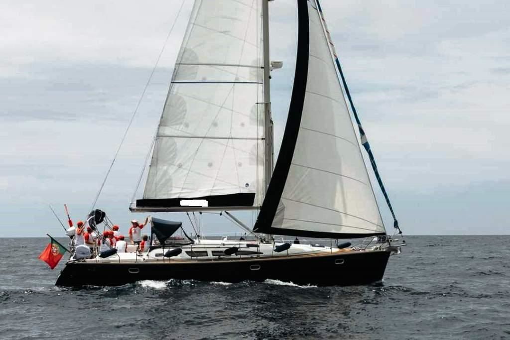 Jeanneau Odyssey 43 Sailing yacht Jeanneau Odyssey 43, 2004 model, cruising on open sea with crew onboard.