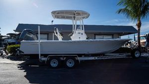 Tidewater 2210 Carolina Bay 2025 Tidewater 2210 Carolina Bay boat on a trailer, parked near a building.