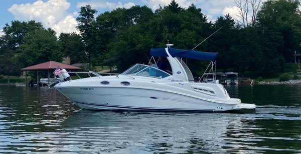 Sea Ray 260 Sundancer 2008 Sea Ray 260 Sundancer cruising on a calm lake with trees in the background.