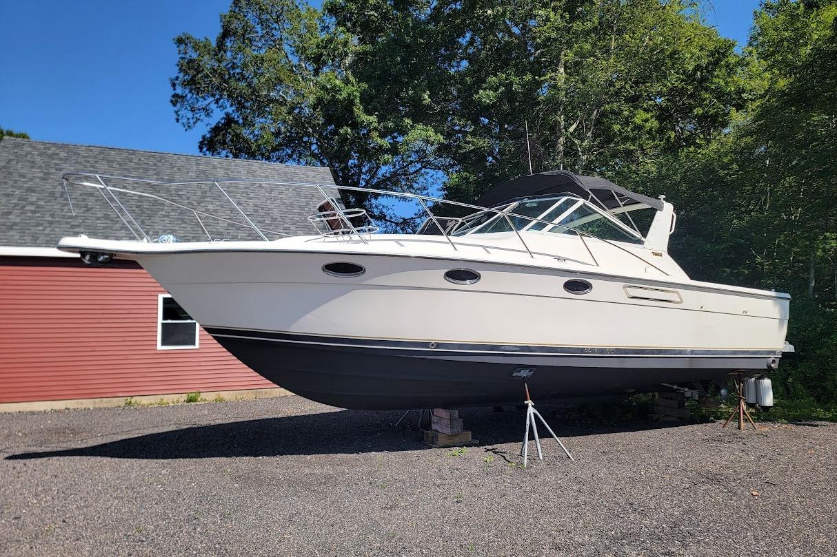 Tiara Yachts 3100 Open with 2017 FWC engines- good value 1995 Tiara Yachts 3100 Open with 2017 FWC engines, parked outdoors.