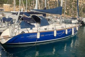 Beneteau Oceanis 411 Celebration 2003 Beneteau 411 Celebration sailboat docked in marina, featuring blue hull and white deck.
