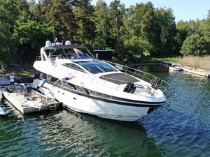 Conam 65 flybridge Luxury 2009 Conam 65 Flybridge yacht docked in scenic, wooded marina.