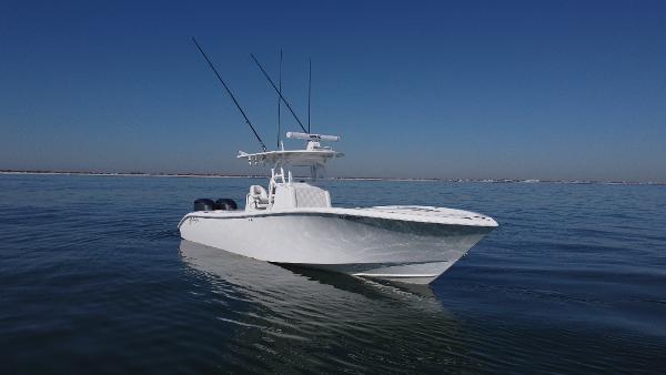 Yellowfin 32 Offshore 2014 Yellowfin 32 Offshore boat on calm water under clear blue sky.