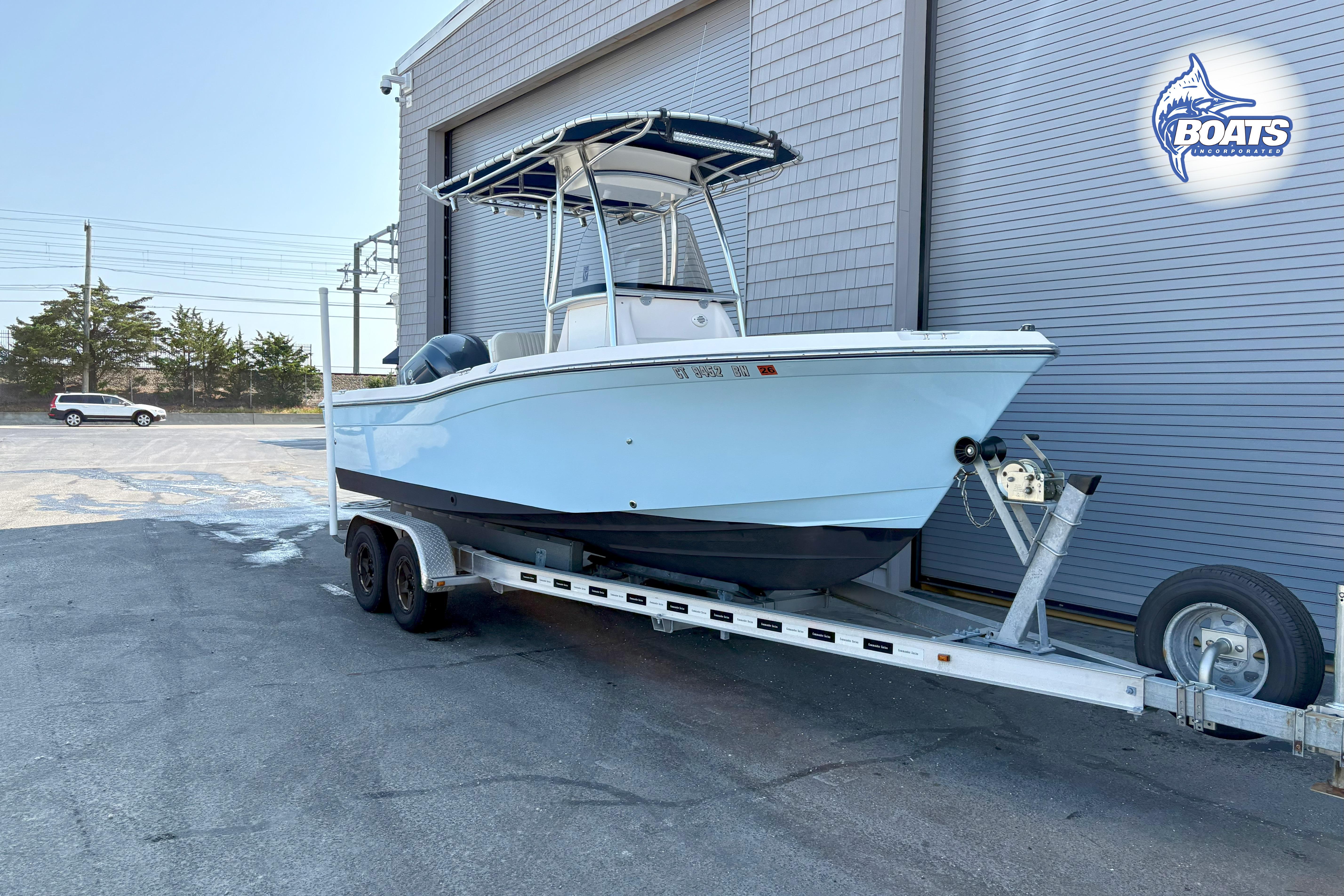 Grady-White Fisherman 209 2013 Grady-White Fisherman 209 boat on trailer outside a building.
