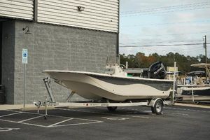 Carolina Skiff 21 LS 2025 Carolina Skiff 21 LS boat on trailer, parked outside a building.