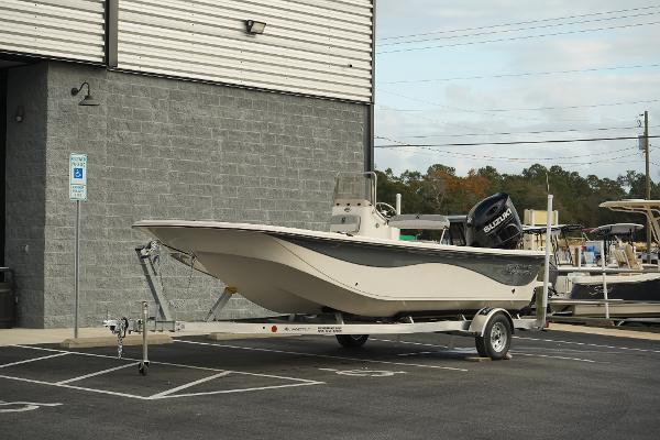 Carolina Skiff 21 LS 2025 Carolina Skiff 21 LS boat on trailer, parked outside a building.