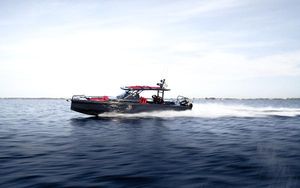 BRABUS 900 2021 BRABUS 900 boat speeding on open water under clear sky.