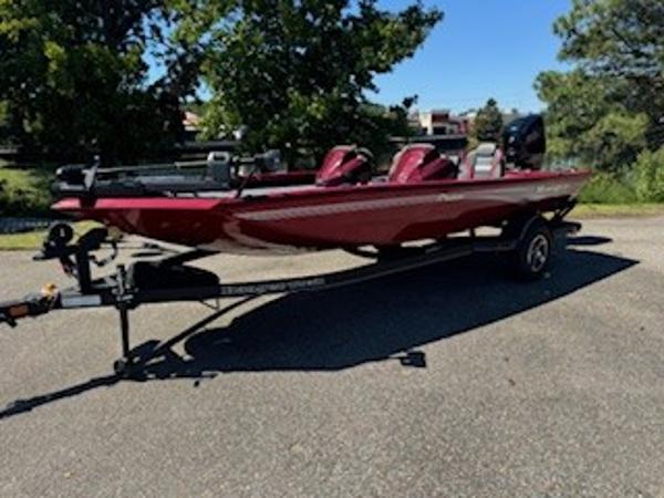 Ranger RT188P 2024 Ranger RT188P boat on trailer, red color, parked outdoors.