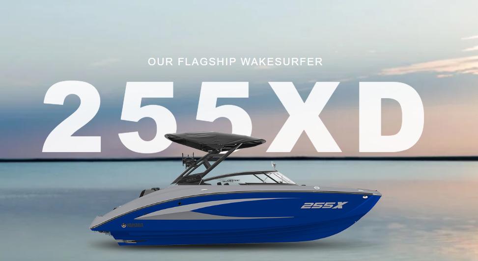 Yamaha Boats 255XD 2025 Yamaha Boats 255XD flagship wakesurfer on serene water background.