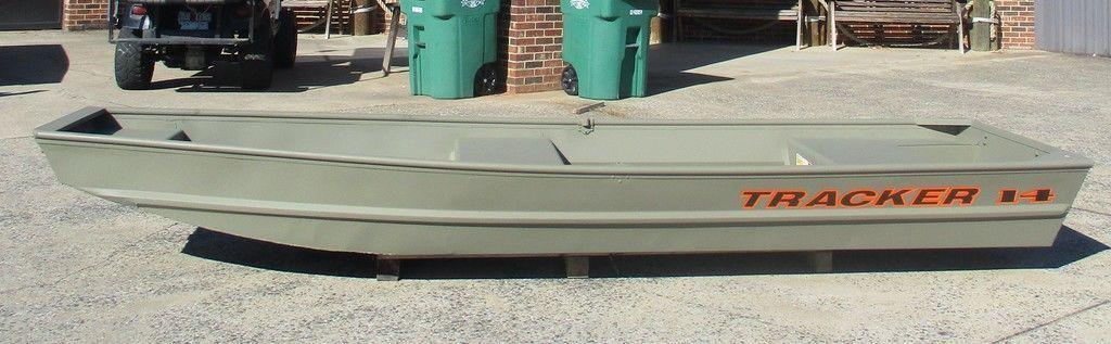 Tracker Grizzly® 1436 Utility 2026 Tracker Grizzly® 1436 Utility boat in a driveway, showcasing its sleek design.