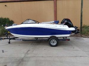 Tahoe 185 S 2024 Tahoe 185 S boat on trailer, blue and white design, parked outdoors.