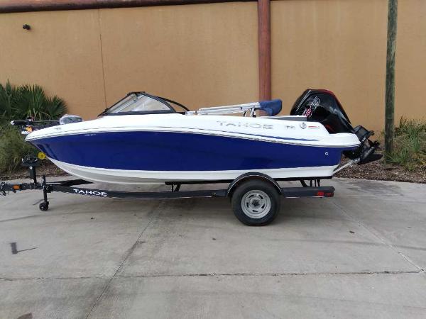 Tahoe 185 S 2024 Tahoe 185 S boat on trailer, blue and white design, parked outdoors.