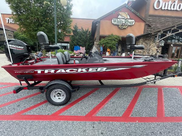 Tracker Pro 170 2025 Tracker Pro 170 boat in red, parked outside White River store.