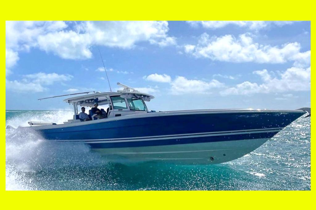 HCB 53 Sueños 2018 HCB 53 Sueños boat cruising on turquoise waters under a clear blue sky.