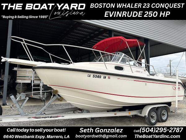 Boston Whaler 23 Conquest 1998 Boston Whaler 23 Conquest with Evinrude 250 HP on trailer at The Boat Yard.