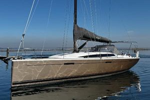 Dehler 46 Competition 2015 Dehler 46 Competition yacht on calm water, sleek design, clear sky background.